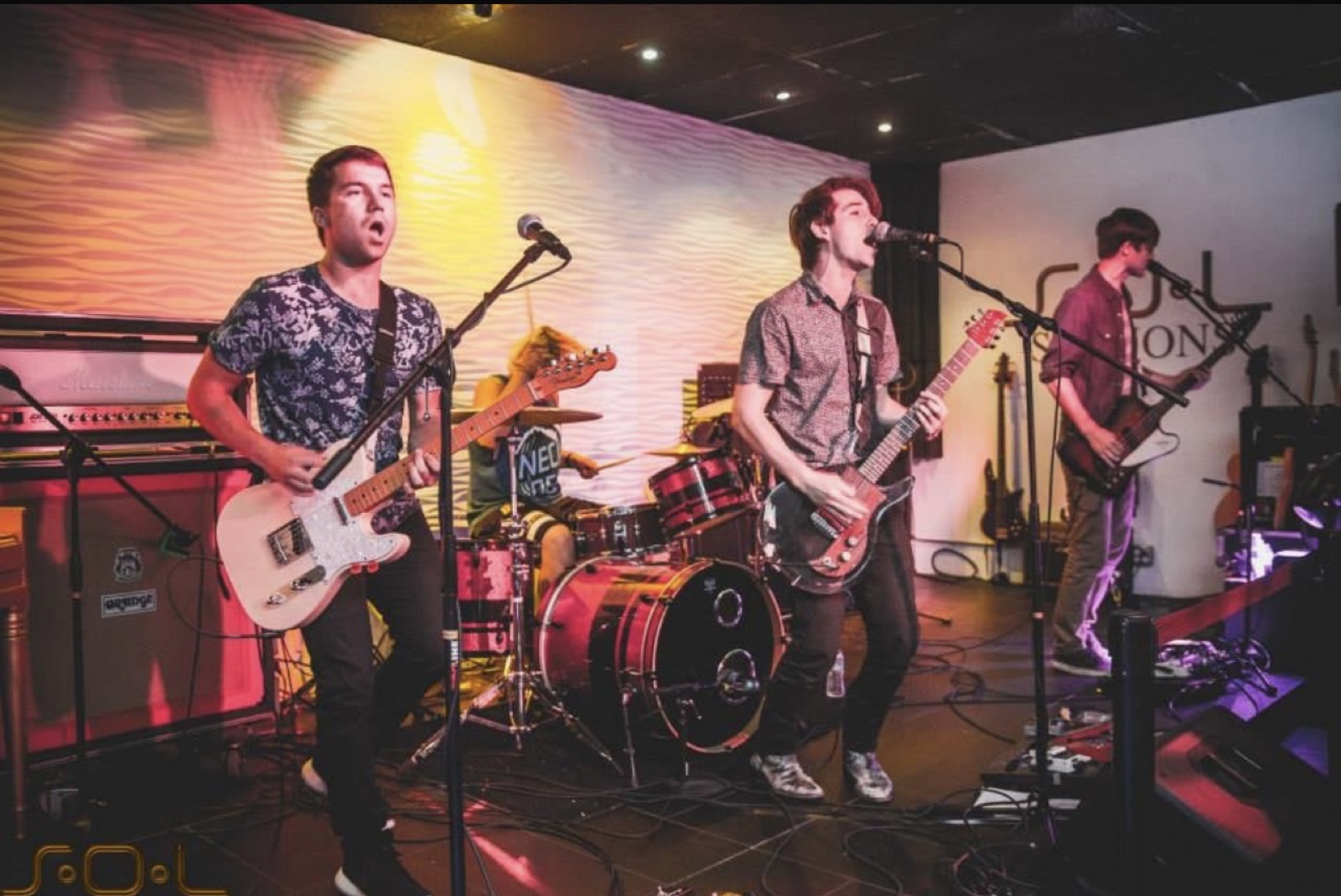 SOL Venue live band performing on stage with dramatic lighting