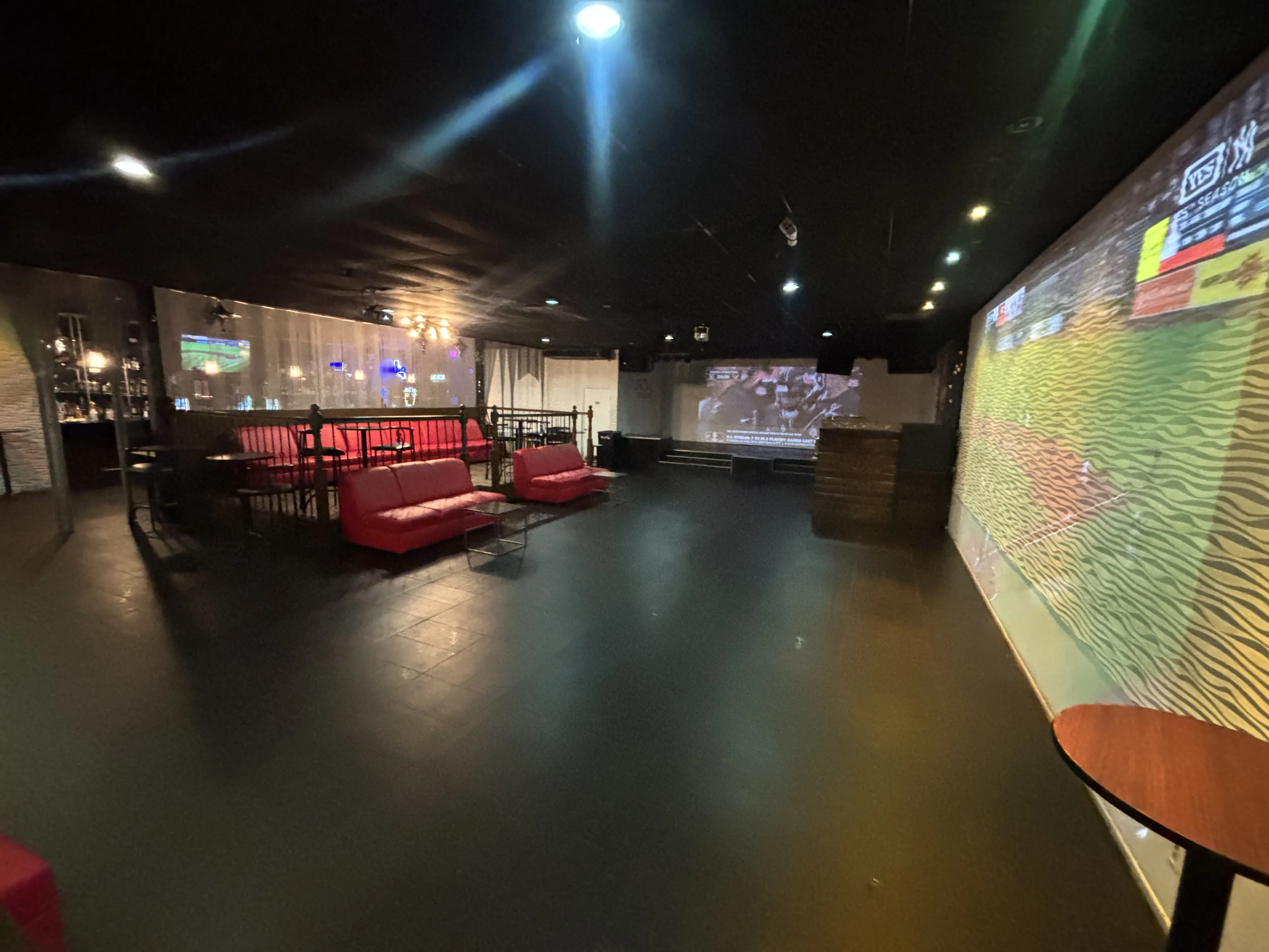 SOL Venue lounge seating and dance floor with red couches